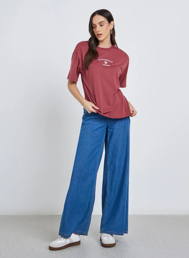 Styli Women Red Bondi Beach Embroidered Oversized T-Shirt