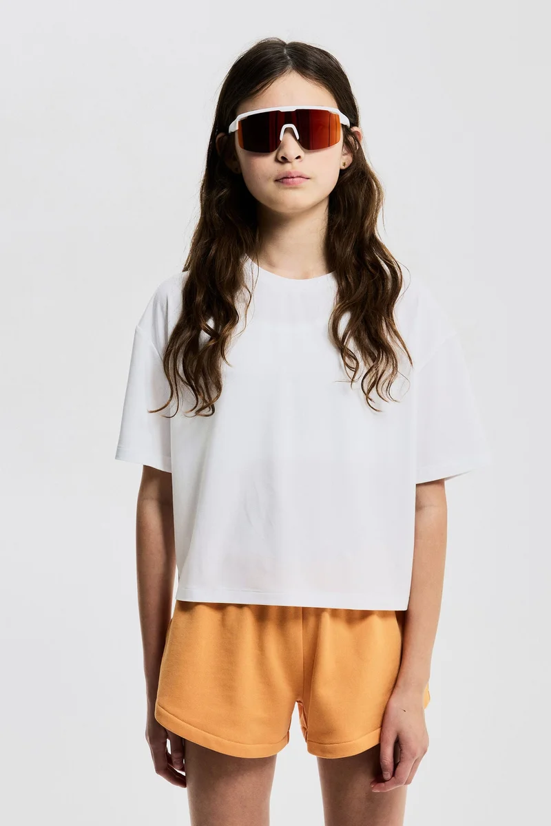H&M Boxy-style sports top with DryMove™