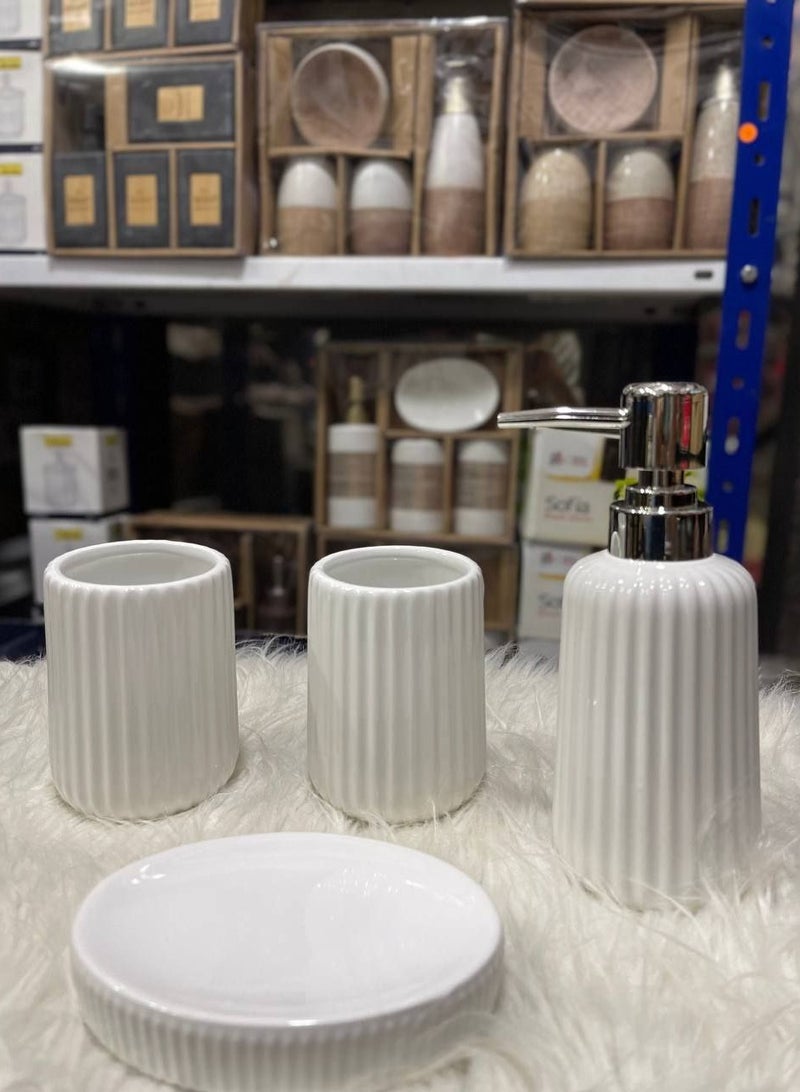 Bathroom set for a modern look in your bathroom Material: Porcelain Colors: White, Black Ribbed Number: 4 pieces Toothbrush holder Shower gel dispenser Soap dispenser Mouthwash cup