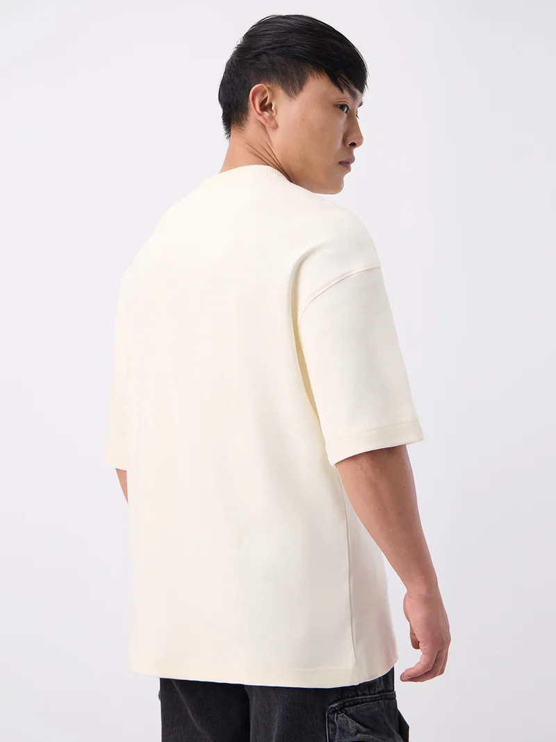 The Souled Store  The Souled Store Super-Oversized Tee: Caffeine Men and Boys Short Sleeves Round Neck Cream Solid Embossed Logo Super Oversized T-Shirts  | Best Price UAE