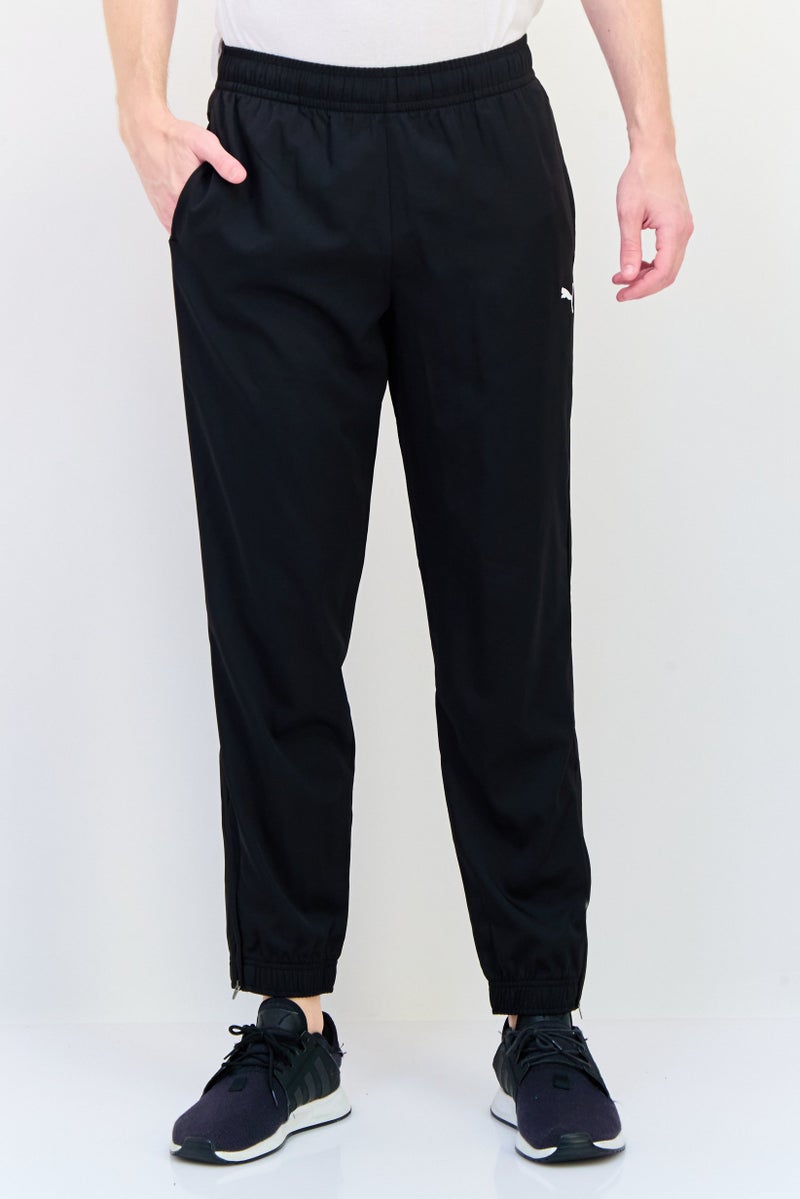 PUMA Men Sportswear Fit Brand Logo Training Track Pants, Black - Image 1