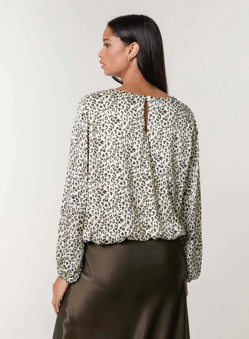 بلو فانيلا بلوزة بطبعة جلد الفهد وحافة مطاطية