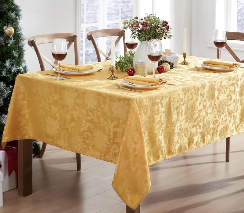 Newbridge Christmas Carol Holiday Noel Damask Tablecloth Holly Leaf and Poinsettia Weave Damask Soil Resistant Wrinkle Free Easy Care Tablecloth 52 x 70 OblongRectangle Gold - Image 1