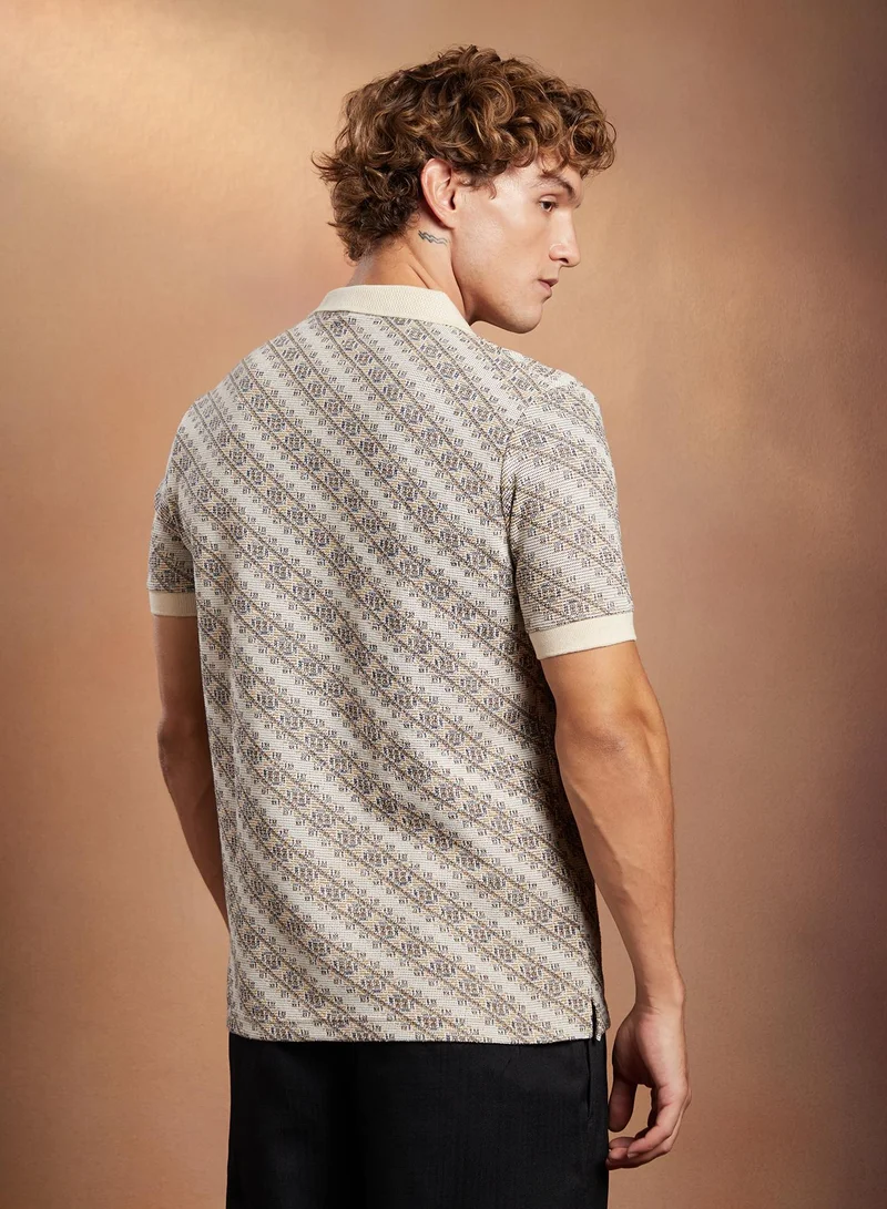 Campus Sutra Campus Sutra Men's Off-White Flora-Slant Polo T-Shirt For Casual Wear | Polo Neck | Short Cuffed Sleeves | Half-Button Closure | T-Shirt Crafted With Comfort Fit For Everyday Wear