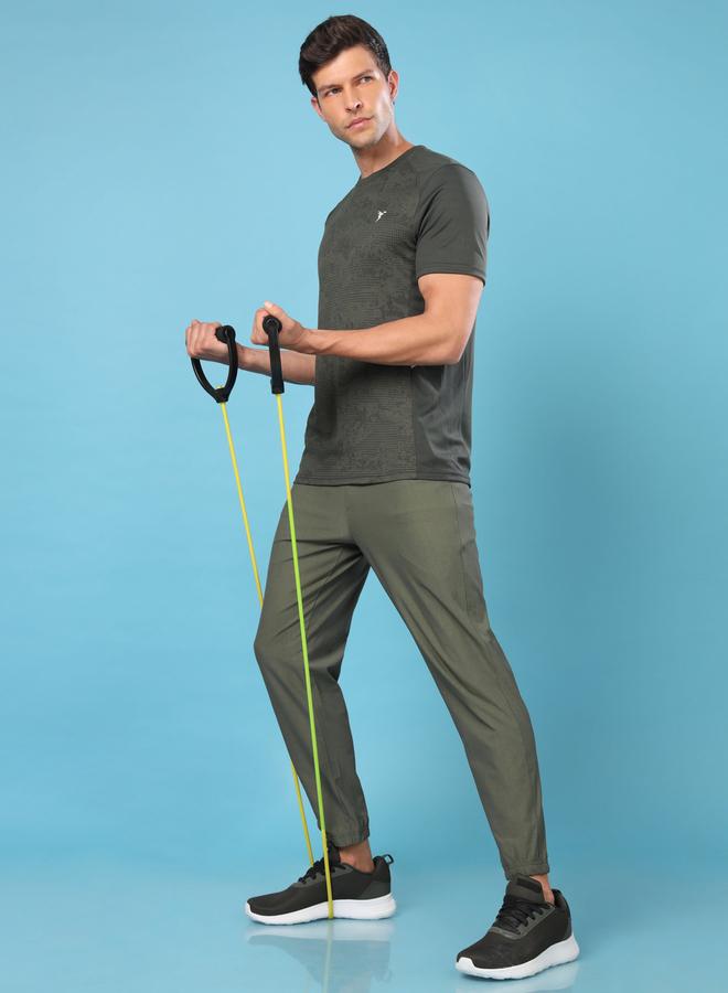 تكنوسبورت بنطلون رياضي رجالي تكنوسبورت أخضر سادة مطاطي بأربعة اتجاهات - Image 1