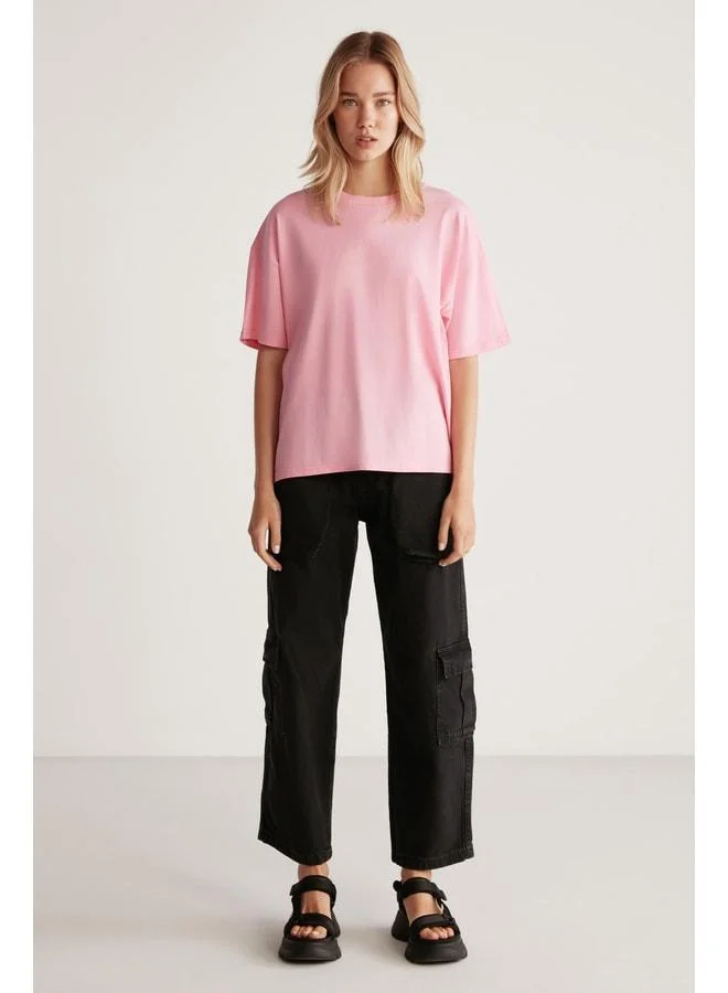 جريميلانج قميص جيمي للنساء 100% قطني عضوي بقطعة مريحة وقصة فضفاضة وشق ورقبة مستديرة ولون وردي فاتح.