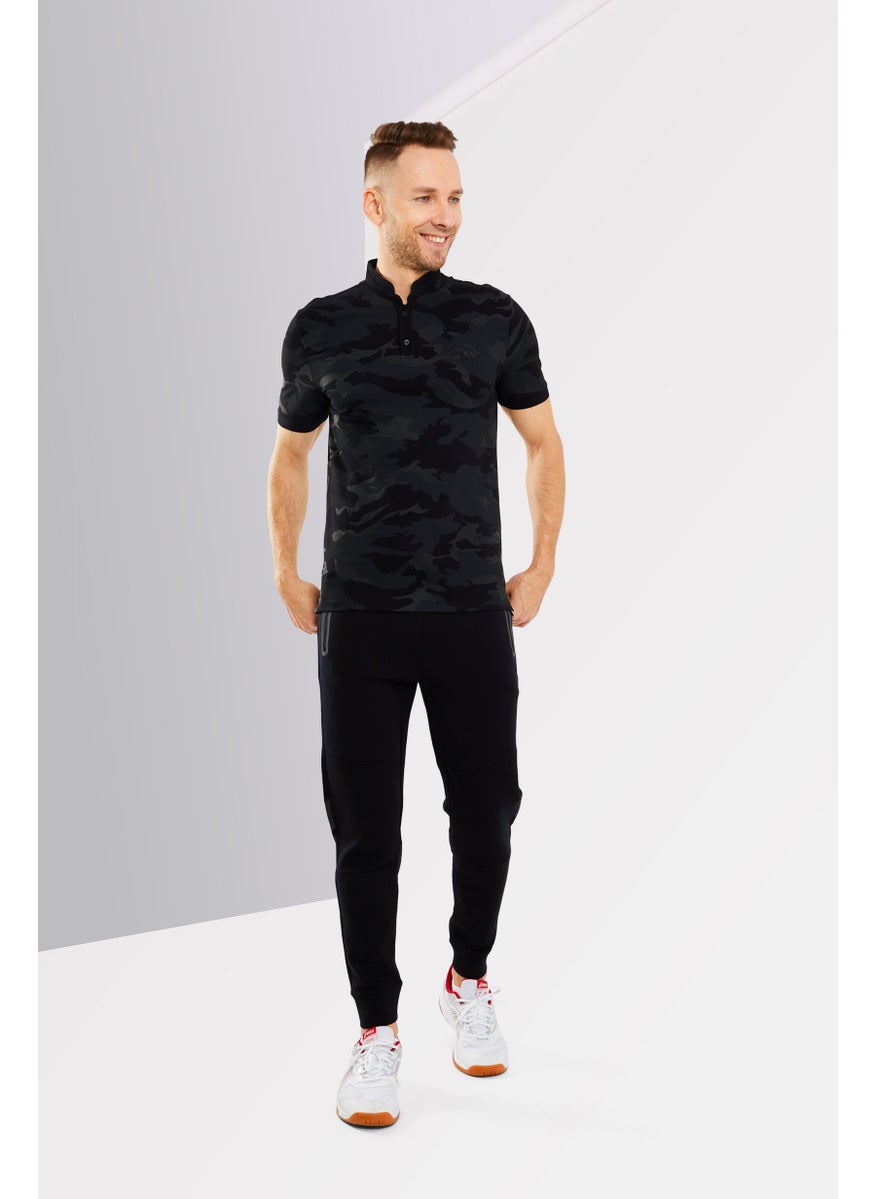 Kooples x Sport - بولو رجال بقصة منتظمة بأكمام قصيرة ومُعَزَّز، أسود - Image 1