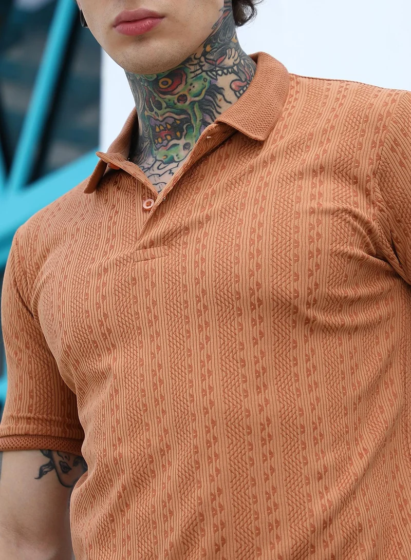 Campus Sutra Campus Sutra Men's Rust Orange Geometric-Folk Knitted Polo T-Shirt | Jacquard Polo Neck , Short Jacquard Cuff Sleeves , Button Closure , Straight Hem | Polyester Blend T-shirt For Casual Wear