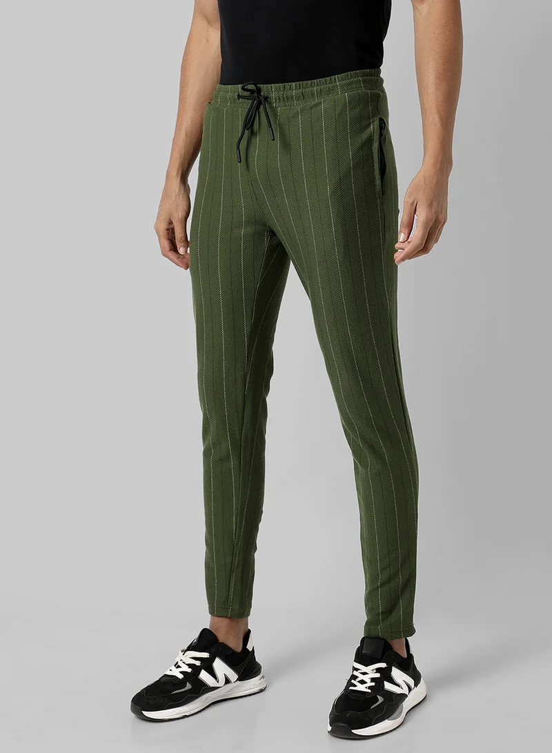 Campus Sutra Campus Sutra Men's Olive Green Striped Regular Fit Trackpants For Casual Wear | Angled Open Pockets | Elasticated Waist | Trackpants Crafted With Comfort Fit & High Performance For Everyday Wear