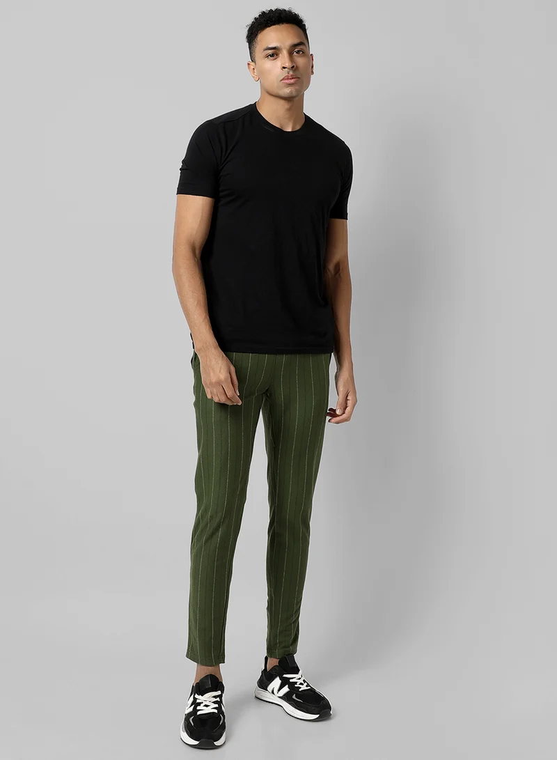 Campus Sutra Campus Sutra Men's Olive Green Striped Regular Fit Trackpants For Casual Wear | Angled Open Pockets | Elasticated Waist | Trackpants Crafted With Comfort Fit & High Performance For Everyday Wear