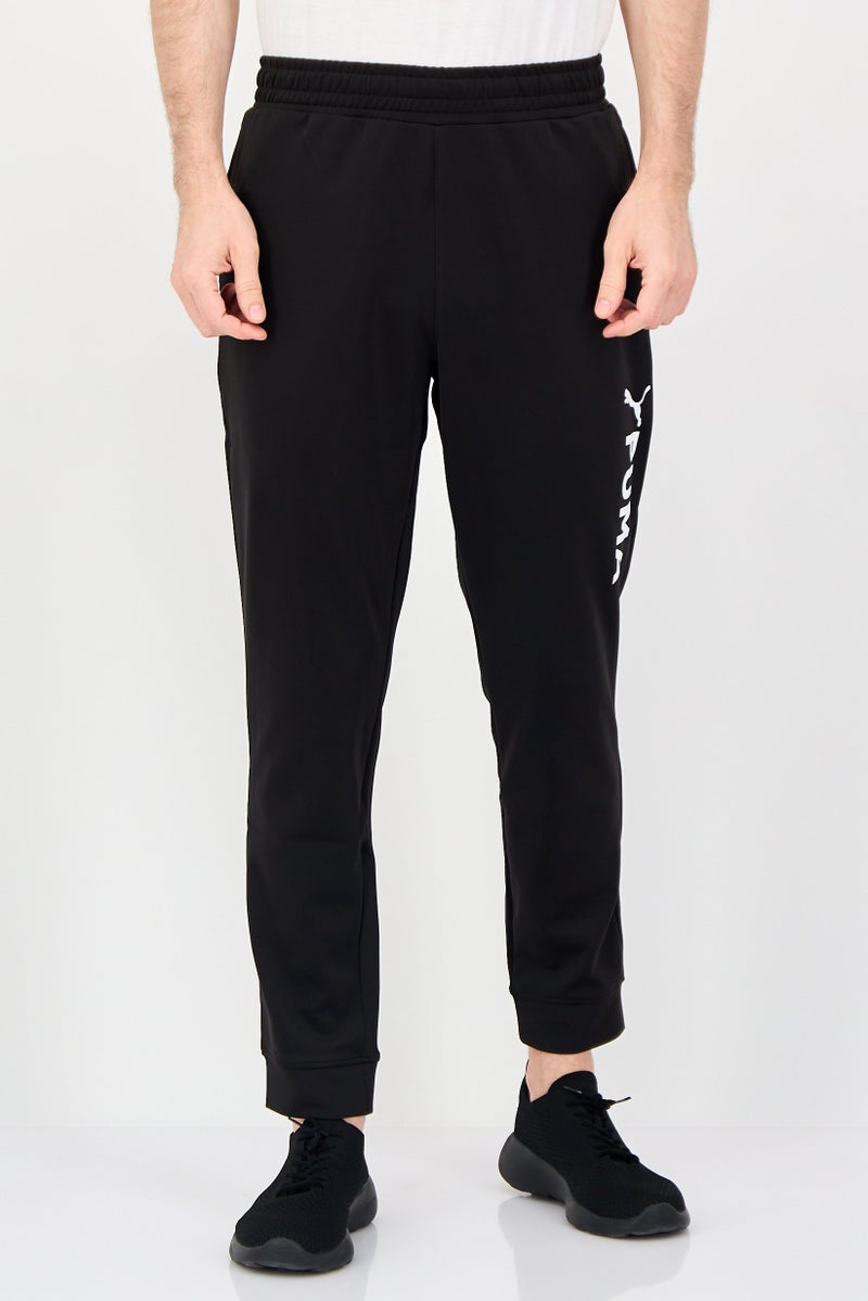 PUMA Men Sportswear Fit Brand Logo Training Track Pants, Black - Image 1