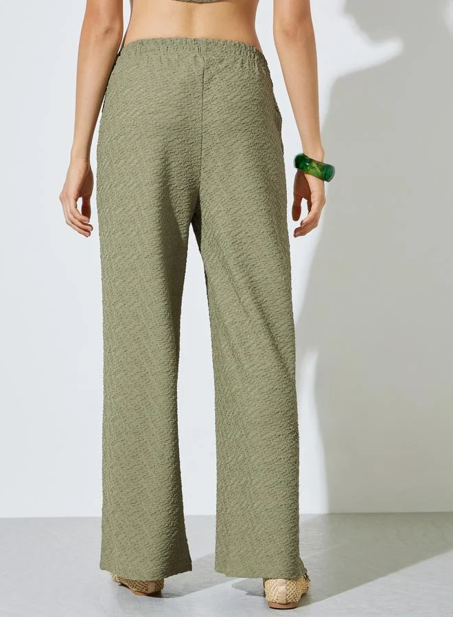 Styli Green Green Textured Wide Leg Pants with Elasticated Waistband for Women | Best Price UAE