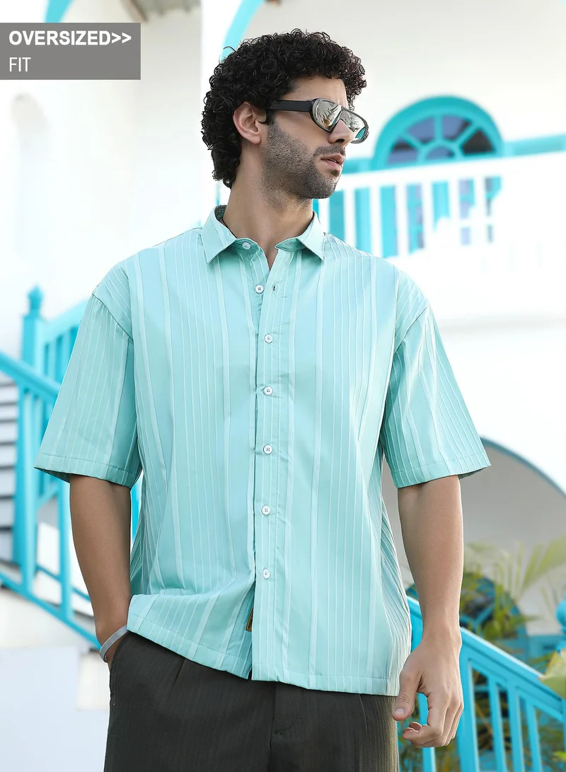 Campus Sutra Campus Sutra Men's Aqua Green Unbalanced-Ridge Oversized Shirt For Casual Wear | Spread Collar | Short Regular Sleeves | Button Closure | Oversized Shirt Crafted With Comfort Fit For Everyday Wear