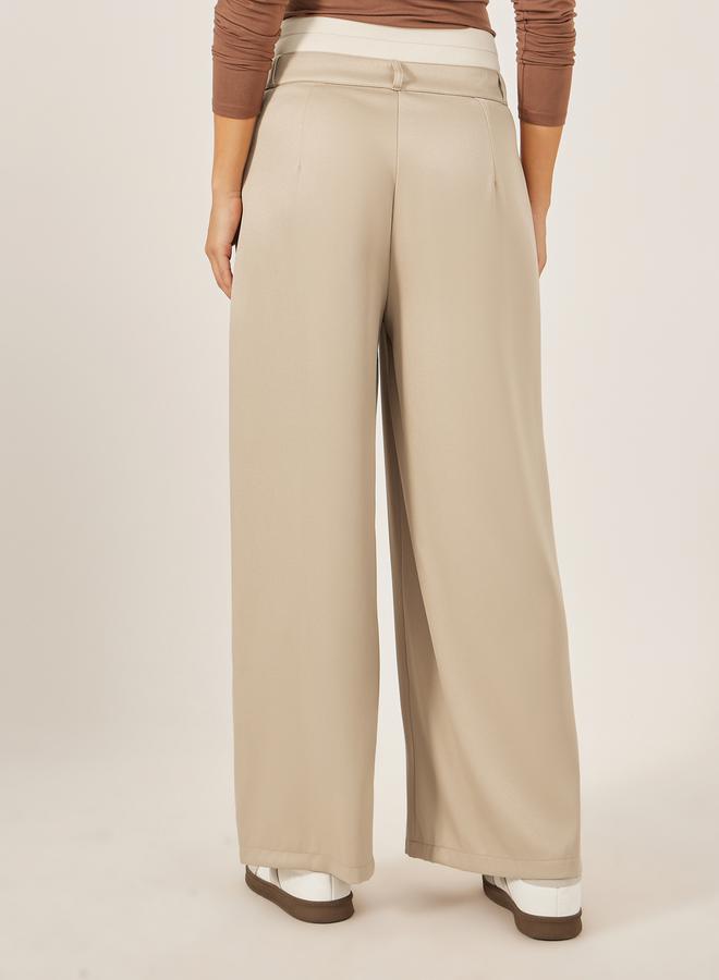 ستايلي بنطلون بيج واسع بخصر مزدوج وتفاصيل ثنيات - Image 4