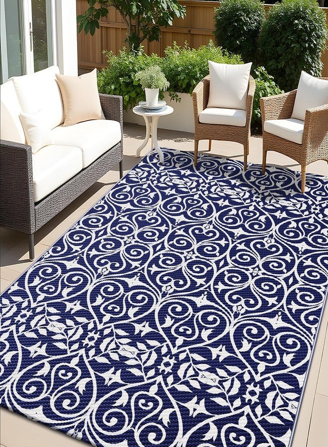 OLANLY Outdoor Rug Waterproof 5x8 ft Clearance, Reversible Plastic Straw Rug with Floral Pattern, RV Mat for Patio, Camping, Balcony, Deck, Backyard, Navy & White - Image 1