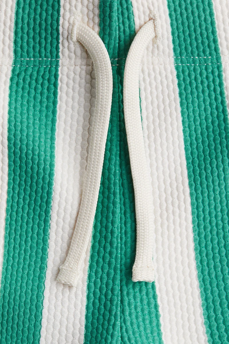 اتش اند ام شورت سباحة منقوش