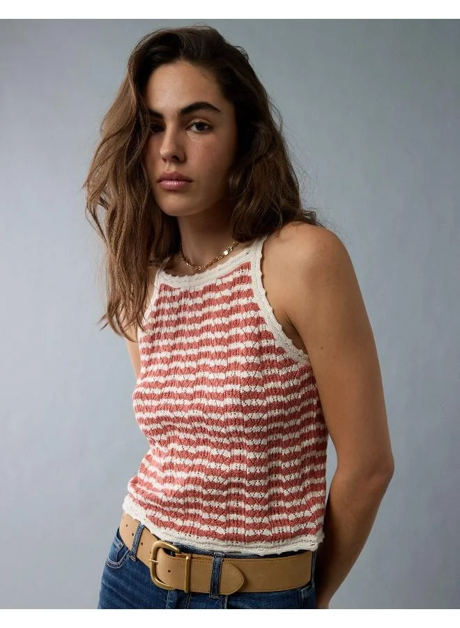 Elevate your warm weather wardrobe with this chic tank top, crocheted for a luxe textured look.