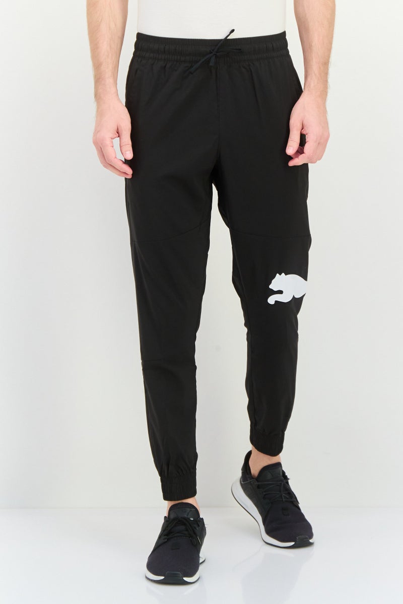 PUMA Men Sportswear Fit Outdoor Sweatpants, Black/White - Image 1