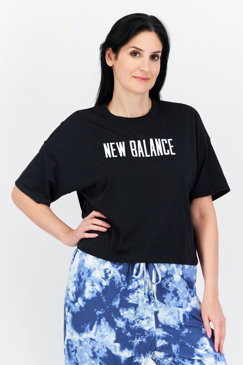New Balance Women Sportswear Fit Short Sleeve Outdoor T-Shirt, Black - Image 1