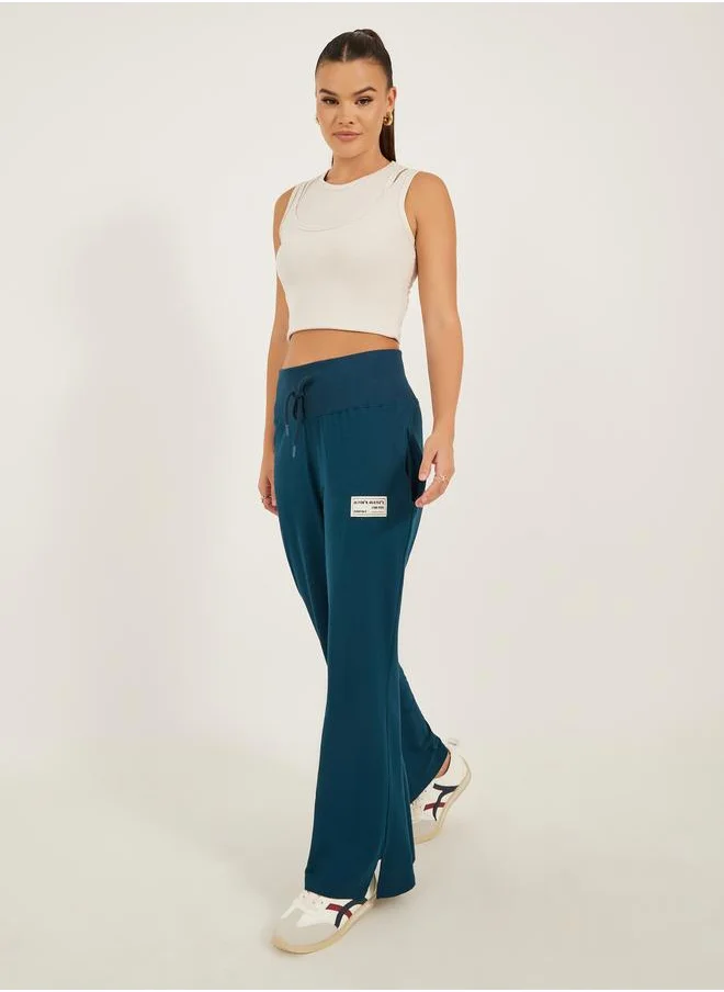 ستايلي Styli Badge Detail Wide Leg Joggers with Side Slit