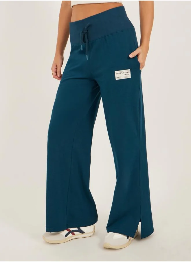 ستايلي Styli Badge Detail Wide Leg Joggers with Side Slit