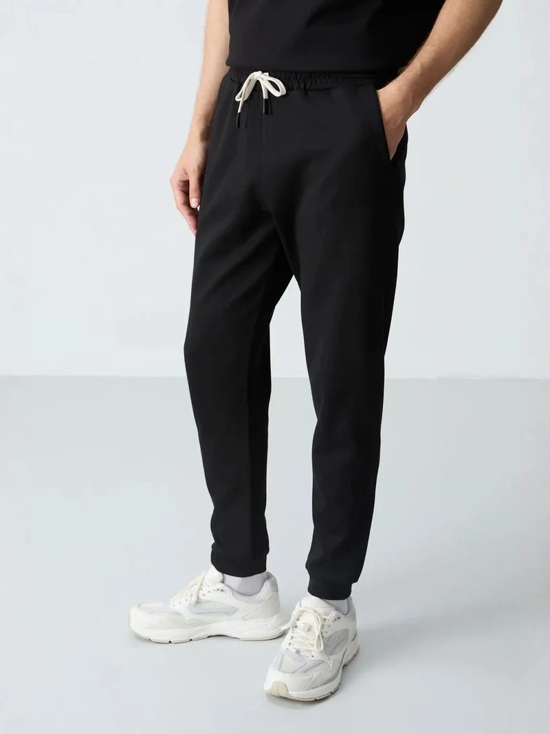 تومي لايف TOMMY Men's Oversized T-shirt And Pants Set