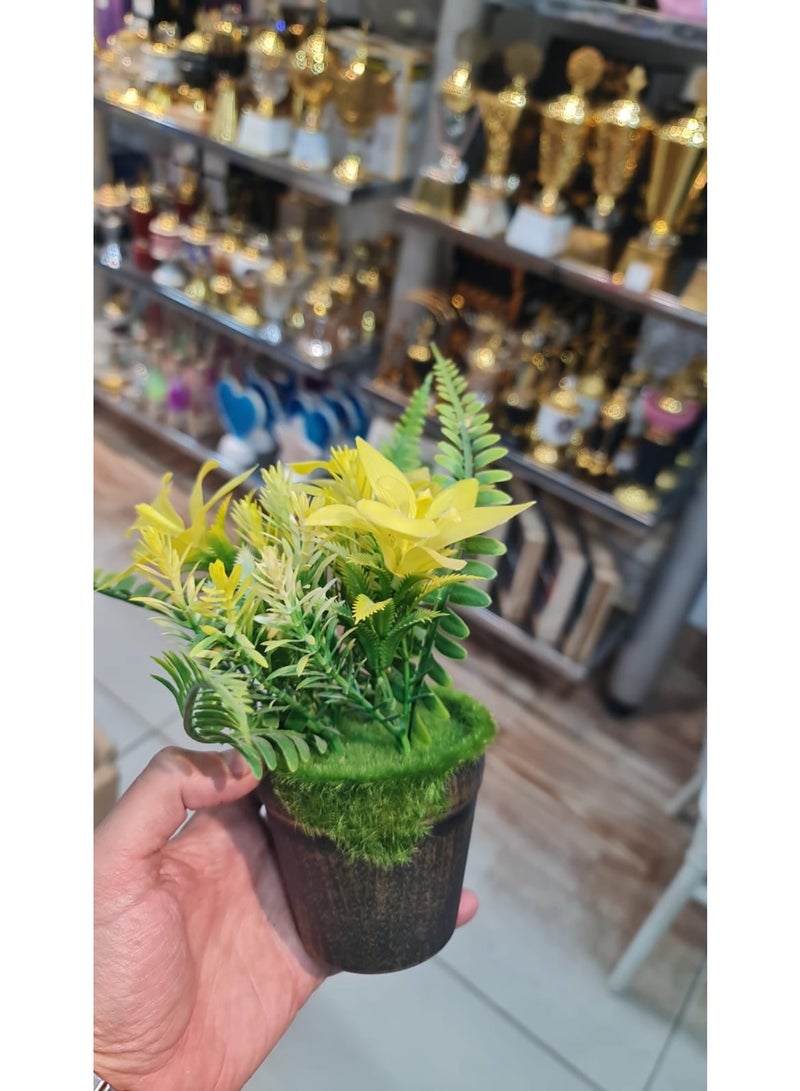 Small artificial plant pot with yellow flowers - a modern home and office decor piece with a natural touch