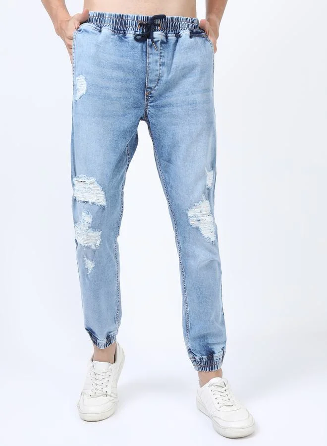 Ketch Light Fade Distressed Jeans with Drawstring Closure by Styli