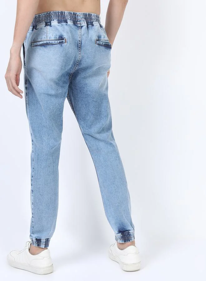 Ketch Light Fade Distressed Jeans with Drawstring Closure by Styli