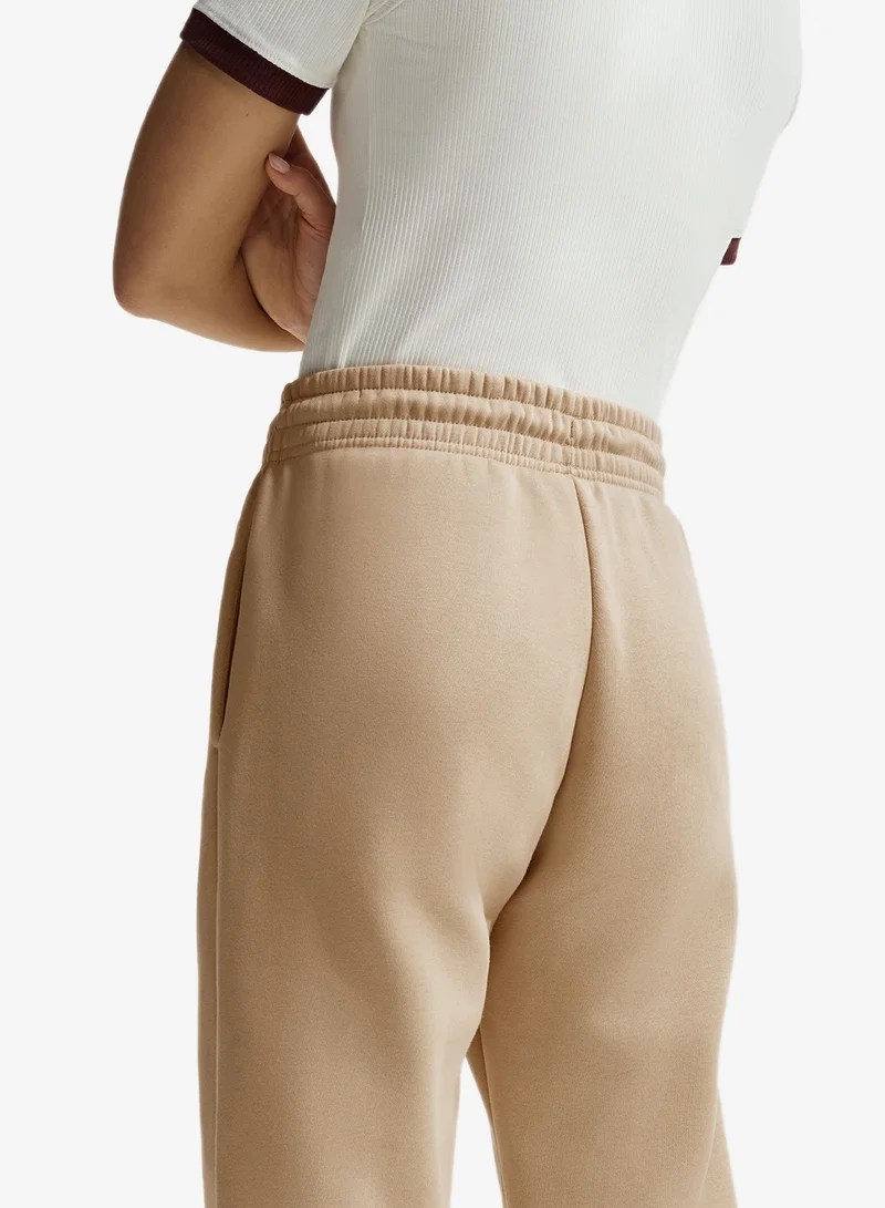 Nike LINEN/(SAIL) Nsw Phoenix Fleece Mid-Rise Standard Pants for Women | Best Price UAE