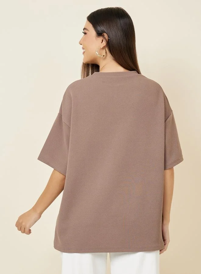 Styli Brown Oversized Contrast Slogan Print Textured T-Shirt for Women | Best Price UAE