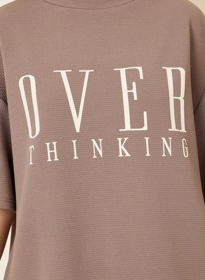 Styli Brown Oversized Contrast Slogan Print Textured T-Shirt for Women | Best Price UAE