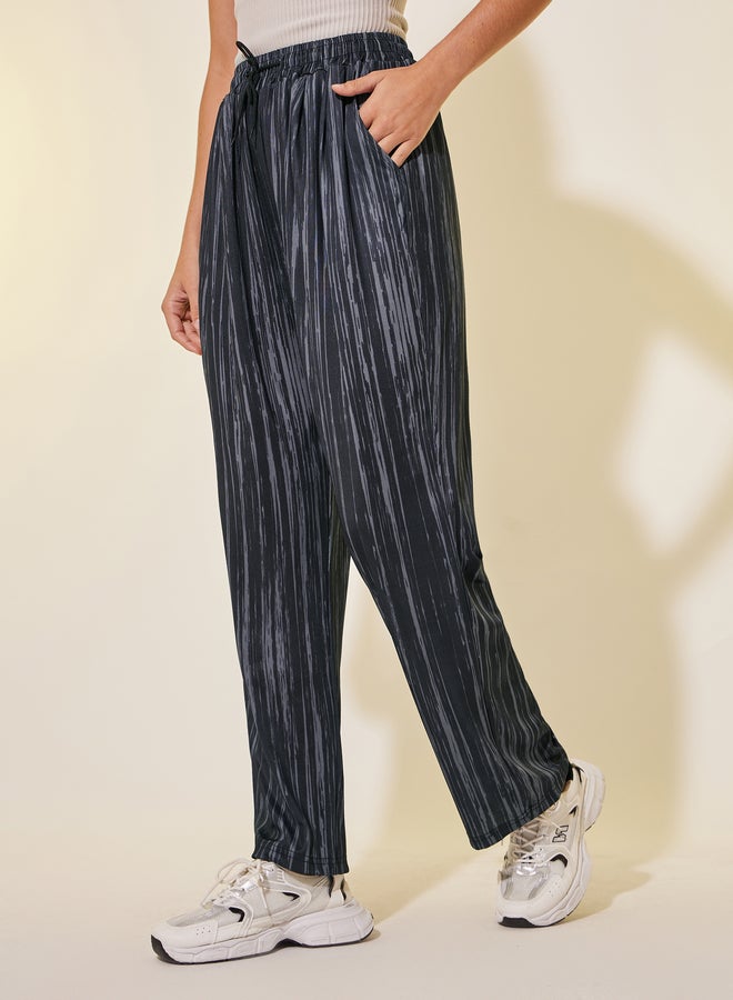 تايك تو بنطلون واسع الساق برباط خصر مطبوع - Image 2