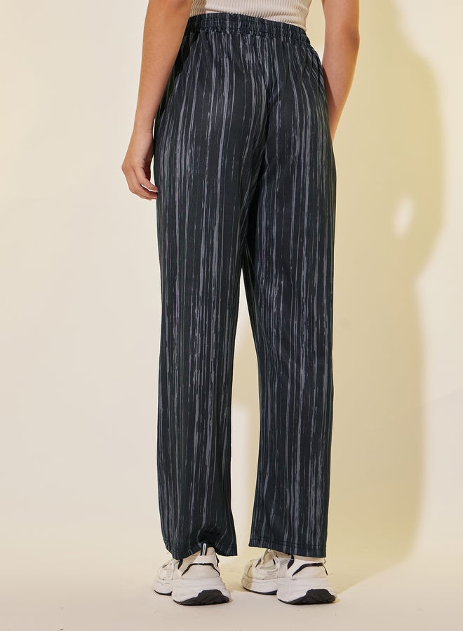 تايك تو بنطلون واسع الساق برباط خصر مطبوع - Image 4