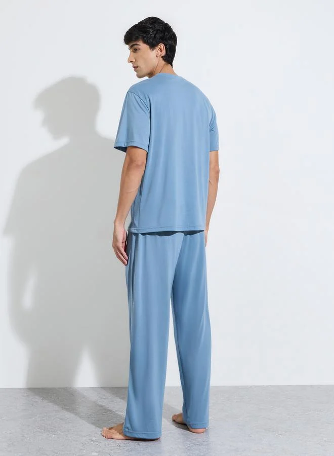 Styli  Blue Slogan Print T-Shirt and Straight Leg Pants Pyjama Set for Men | Best Price UAE