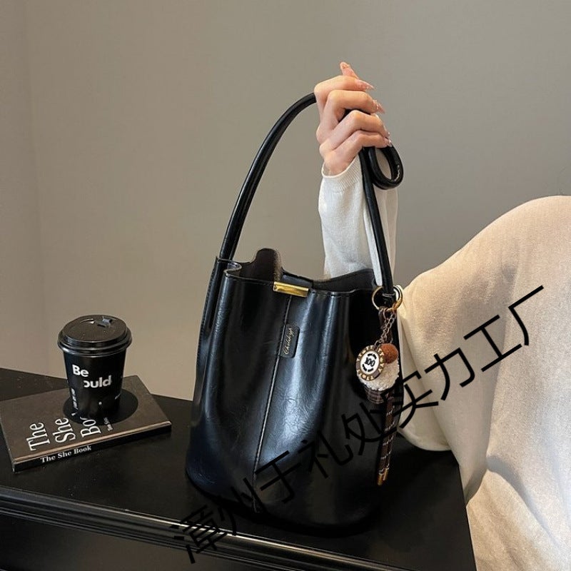 The Retro Bucket Bag Is Decorated With A Playful Fur Ball Pendant. It Can Be Worn On One Shoulder Or Cross-Body, Unlocking A Lazy And Fashionable Feel - Image 5