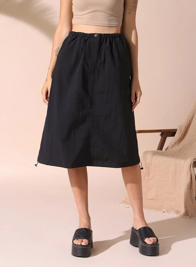 Dennis Lingo Women black regular fit solid nylon skirt with button closure- tailored to elevate your everyday.