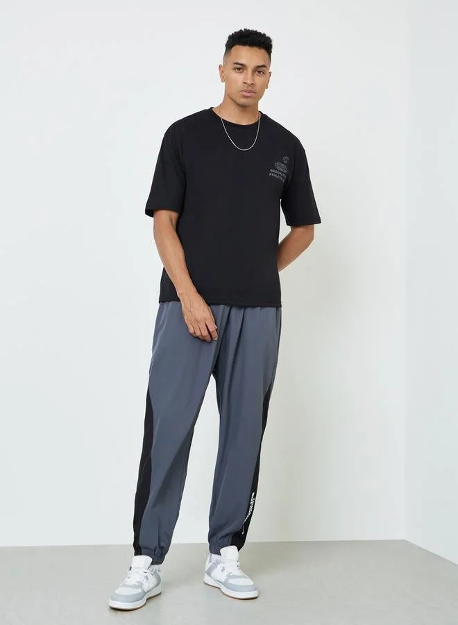 Styli Men Graphic Print Oversized Jersey T-Shirt