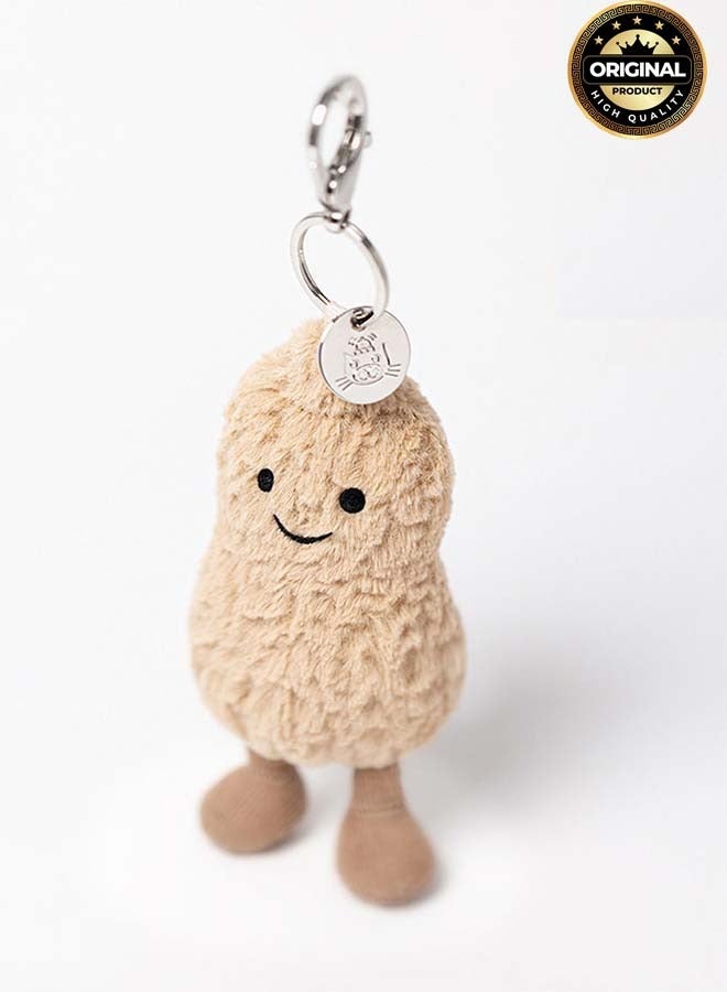 Jellycat سحر حقيبة الفول السوداني من أميزيبلز - سلسلة مفاتيح فول سوداني محشوة لطيفة بوجه مبتسم وقفل معدني - إكسسوار حقيبة ناعم بطول 18 سم للحقائب والمفاتيح والهدايا - Image 1