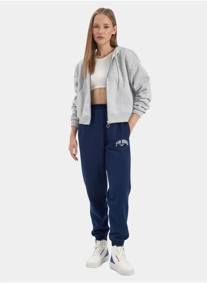 ديفاكتو Slogan Print Elasticated Cuff Joggers with Pockets by Styli