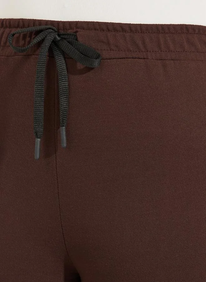 Styli Solid Flared Joggers with Drawstrings