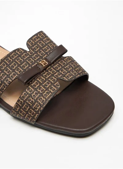 Flora Bella By Shoexpress Monogram Print Slip-On Sandals with Bow Applique