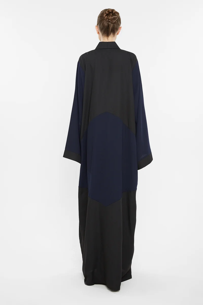 NUKHBAA A casual duo-colored abaya in black and navy blue with cross cut detail-AJ124A