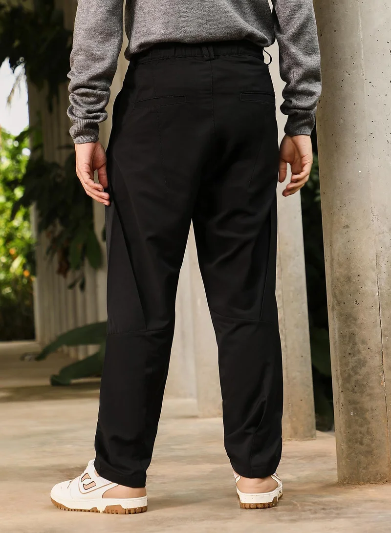 CAHOOT  Men Pleated Relaxed Trousers | Mid-Rise, Side-Elasticaed Stretch | Drawstring , Straight Hem | Solid Plain | Woven Fabric For Casual & Street Wear | Onyx Black for Men | Best Price UAE