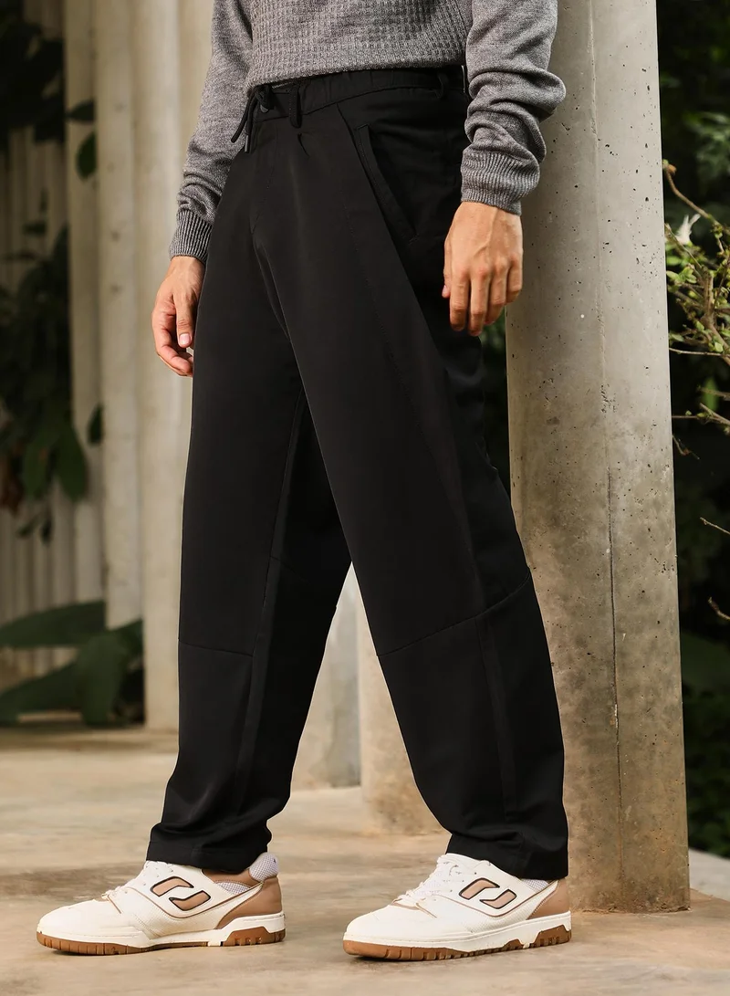 CAHOOT  Men Pleated Relaxed Trousers | Mid-Rise, Side-Elasticaed Stretch | Drawstring , Straight Hem | Solid Plain | Woven Fabric For Casual & Street Wear | Onyx Black for Men | Best Price UAE