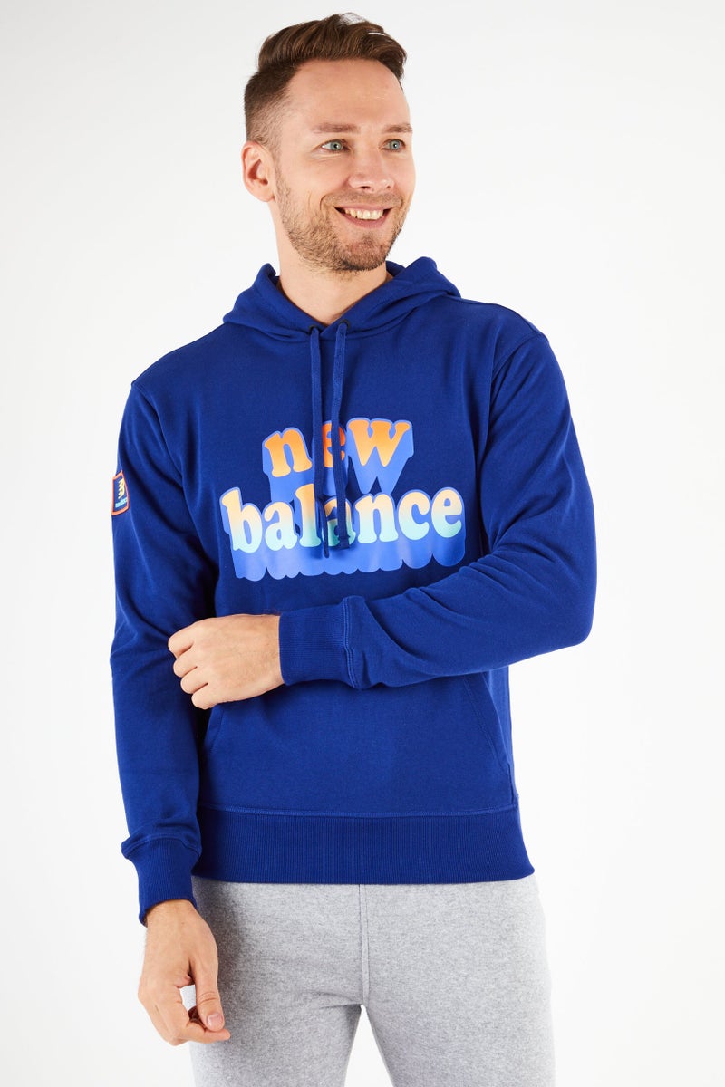 New Balance هودي تدريب بأكمام طويلة للرجال بتصميم مريح، أزرق - Image 1