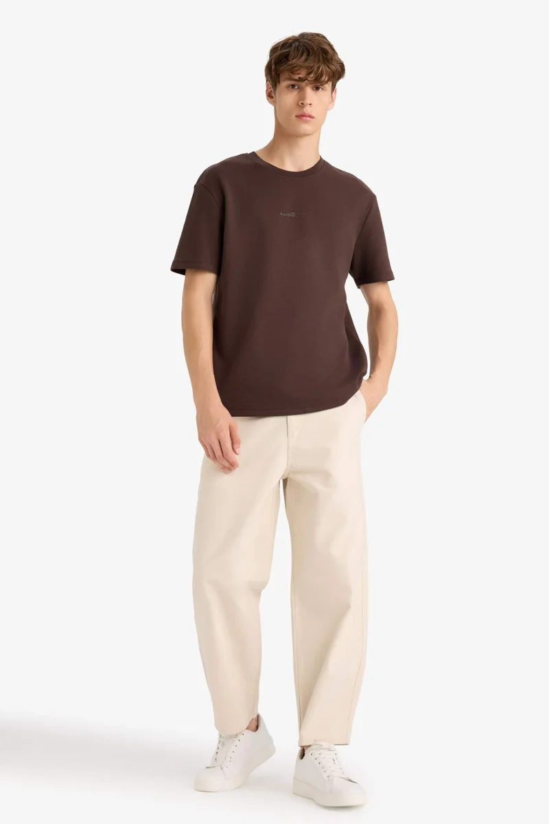 ديفاكتو Boxy Fit Crew Neck Printed Short Sleeve T-Shirt