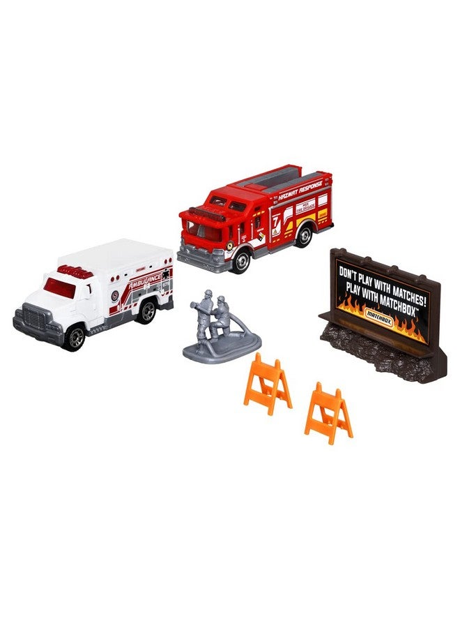 Matchbox Hitch & Haul Die-cast Vehicle Playset - Fire Rescue ~ 6 Piece Set ~ Hazmat Response Truck and Ambulance ~ Includes Firefighters, Billboard Sign and 2 Safety Barriers - Image 1