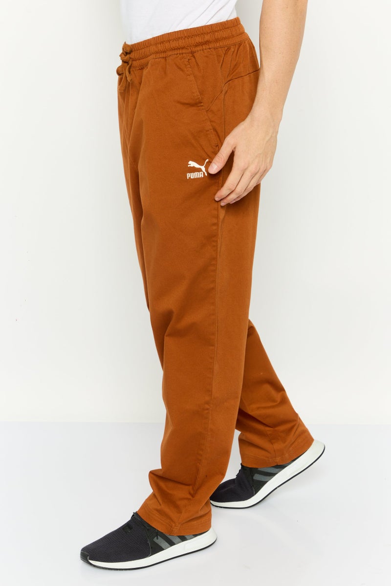 PUMA Men Sportswear Fit Embroidered  Logo Outdoor Sweatpants, Rust Brown  - Image 2