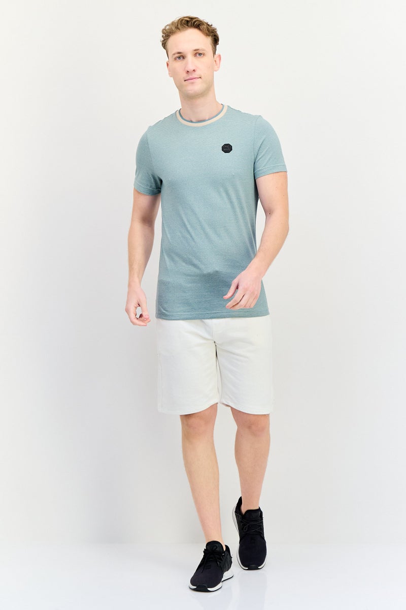 PUMA تي شيرت رجالي قصير الأكمام بتصميم جرافيكي ضيق، أخضر رمادي - Image 4